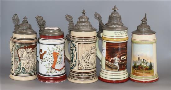 A collection of five pewter mounted beer steins